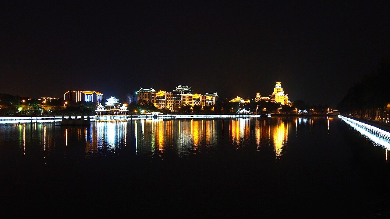Night lights reflecting across the water at Jimei School Village